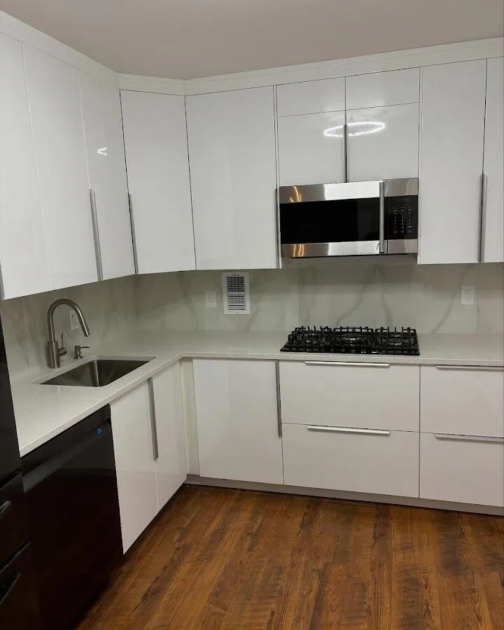 Restored kitchen with white cabinets after water damage in Mililani Mauka